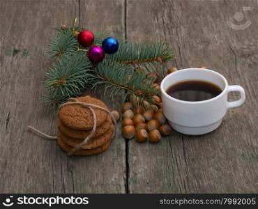coffee, fir-tree branch, linking of oatmeal cookies and forest nutlets, subject holidays Christmas and New Year