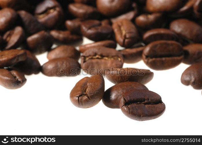 Coffee grains. It is isolated on a white background the Photo close up