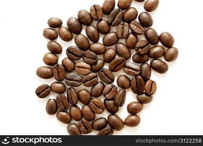 Coffee grains on white background