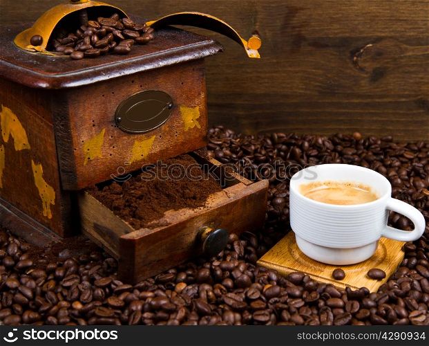 Coffee Grinder with Beans and coffee cup