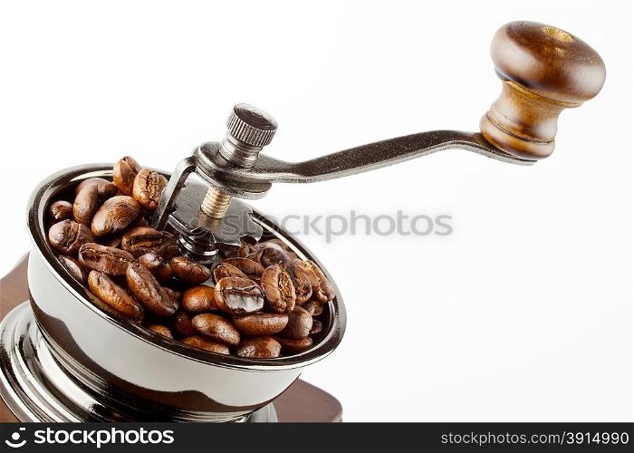 Coffee grinder with coffee beans isolated on a white background