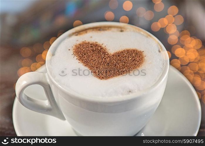 Coffee heart shape. Coffee cup with milk and heart shape