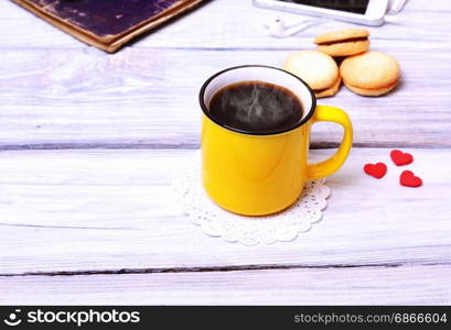 Coffee in a yellow mug, top view