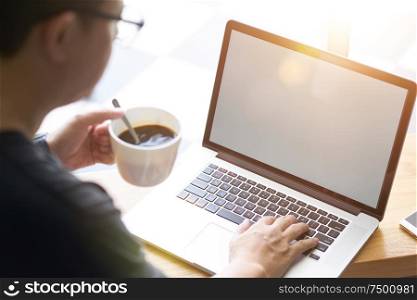Coffee in businessman hand with Laptop .