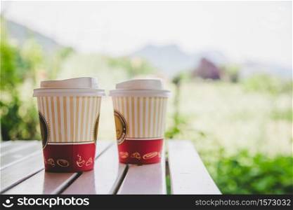 Coffee in paper cup for making a break, outdoors