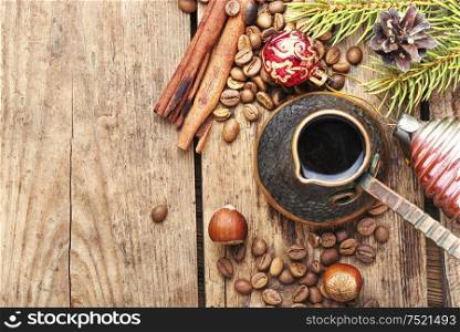 Coffee in retro cezve and christmas decoration. Christmas coffe and toy