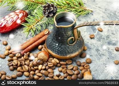 Coffee in retro cezve and christmas decoration. Christmas toy and coffe