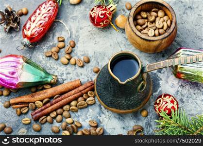 Coffee in retro cezve and christmas decoration. Christmas toy and fragrant coffe