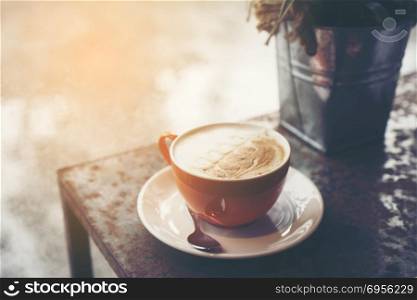 coffee latte art in coffee shop cafe, vintage filter image