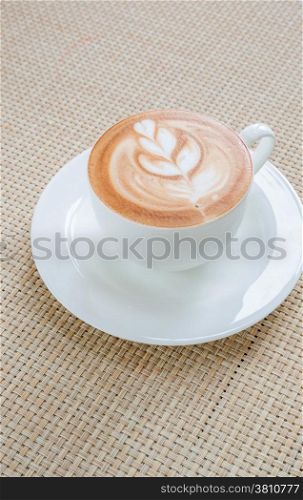 Coffee latte art in white cup