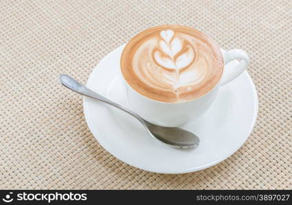 Coffee latte art in white cup