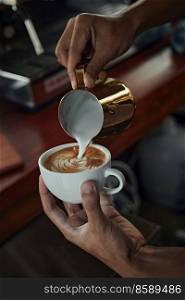 coffee latte art making by barista 
