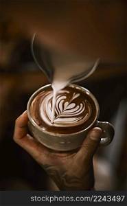 coffee latte art making by barista . Hot latte art making by barista 
