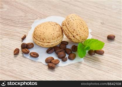 coffee  macaroons with raw coffee beans  on table