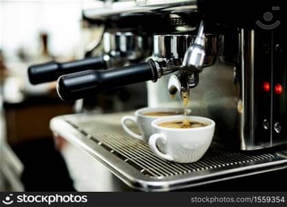 Coffee machine espressos shot in white cups