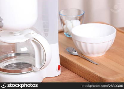 Coffee maker and bowl with sugar