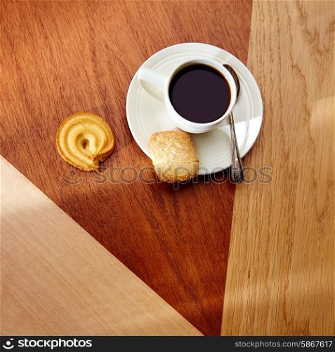 Coffee morning with biscuits on wooden modern table