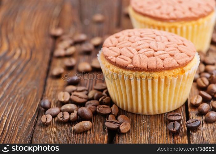 coffee muffins and coffee beans on a table