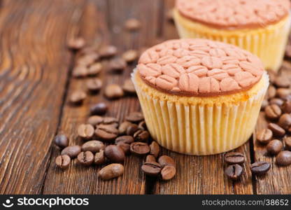 coffee muffins and coffee beans on a table