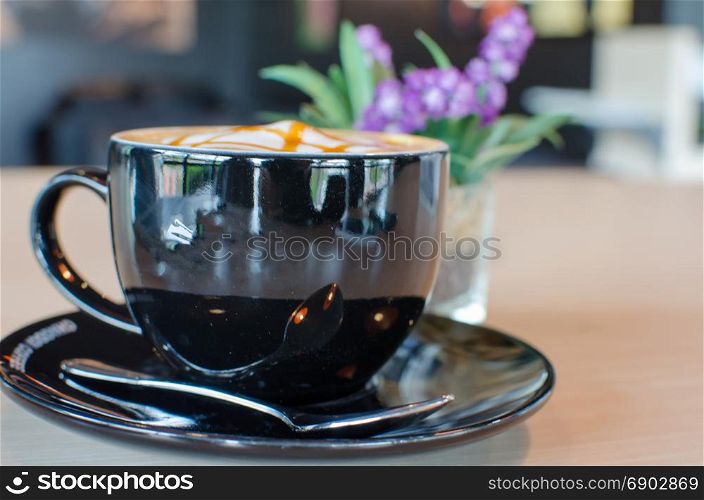 Coffee Mug Black on table.