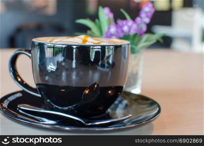 Coffee Mug Black on table.