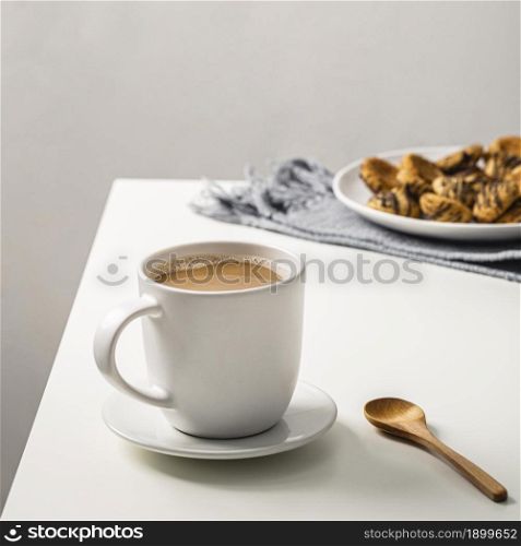 coffee mug table with cookies plate spoon. Resolution and high quality beautiful photo. coffee mug table with cookies plate spoon. High quality beautiful photo concept