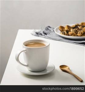 coffee mug table with cookies plate spoon. Resolution and high quality beautiful photo. coffee mug table with cookies plate spoon. High quality beautiful photo concept