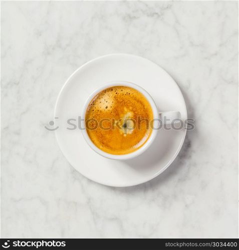 Coffee on white marble background. Minimal flat lay. Coffee on white marble background. Coffee on white marble background