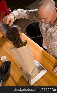 Coffee Packing Roast House Worker Portions Beans into Bag For Sale