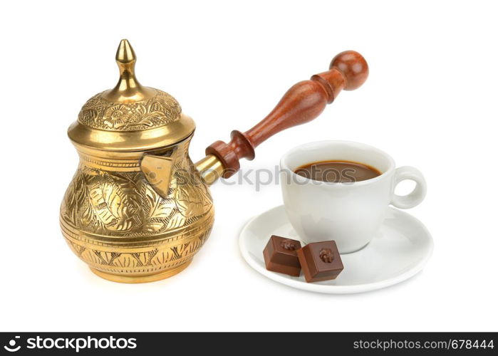 Coffee pot, cup with a drink and chocolate isolated on white background.