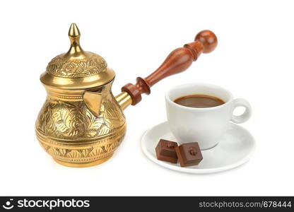 Coffee pot, cup with a drink and chocolate isolated on white background.