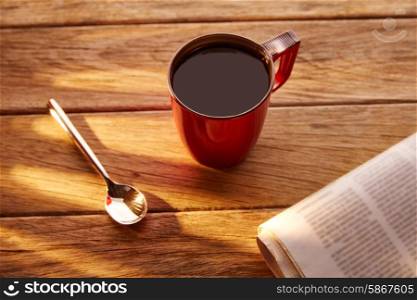 Coffee red cup newspaper morning breakfast on vintage wooden table
