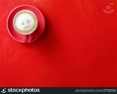 Coffee red cup on red background. Minimal style. Copy space.