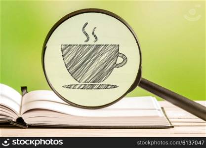 Coffee search with a pencil drawing of a coffee cup in a magnifying glass
