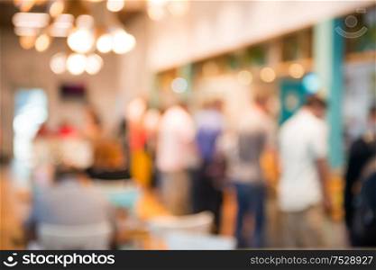 Coffee shop interior with people as blurred cafe background