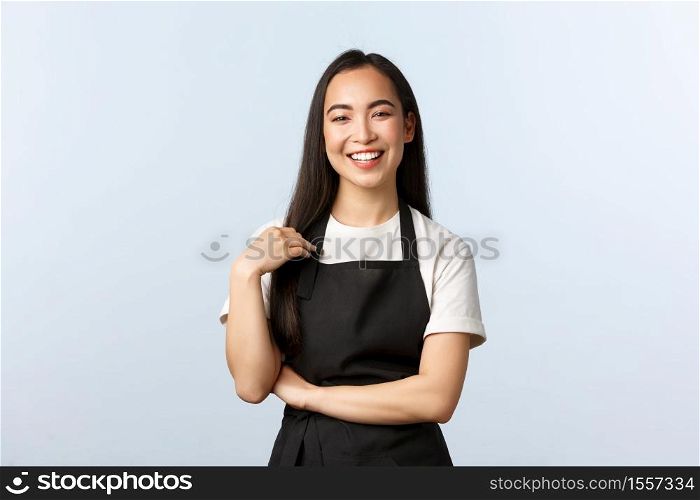 Coffee shop, small business and startup concept. Happy and friendly asian female barista in black apron smiling at client, listening to order, staff at cafe prepare drinks for customers.. Coffee shop, small business and startup concept. Happy and friendly asian female barista in black apron smiling at client, listening to order, staff at cafe prepare drinks for customers