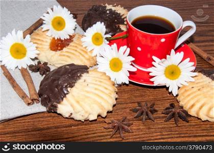 Coffee shortbread cookies and wild flowers camomile