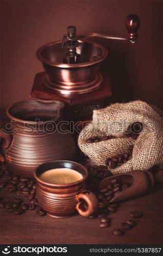 Coffee still life in rustic style over brown background