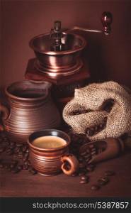 Coffee still life in rustic style over brown background
