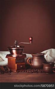 Coffee still life in rustic style over brown background. Coffee still life