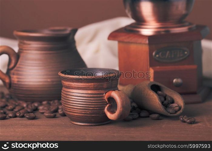 Coffee still life in rustic style over brown background. Coffee still life