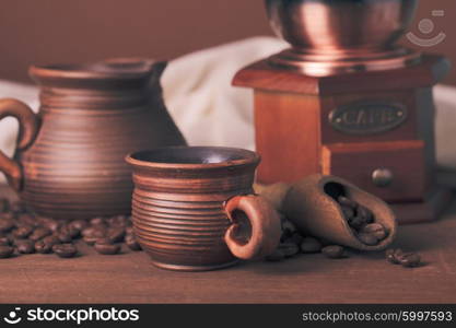 Coffee still life in rustic style over brown background. Coffee still life