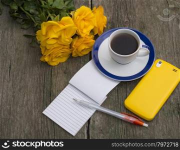 coffee still life yellow roses, phone and notebook, top view, subject beautiful flowers and drinks, greeting card