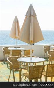 coffee table and umbrella in the seashore. coffee bar.