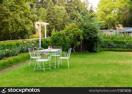 Coffee table in yard, ancient European tourist city. Summer tourism and travels, famous europe landmark. Coffee table in yard, ancient European city