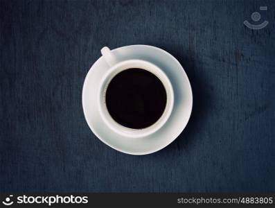 Coffee time. Close up of coffee cup on stone surface