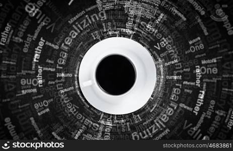 Coffee time. Top view of cup of coffee on dark background