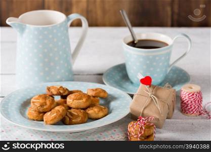 Coffee with delicious homemade cookies and a gift box