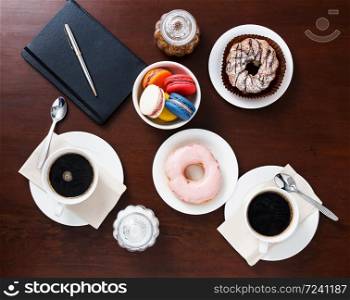 Coffee with dessert on the table,top view.. Coffee with dessert.