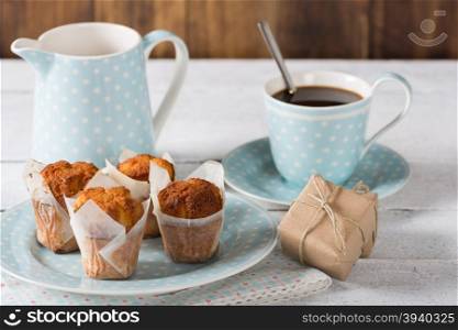 Coffee with homemade muffins and surprise gift